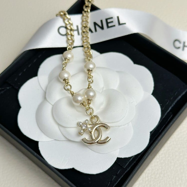 Double row pearls and diamonds double C bracelet