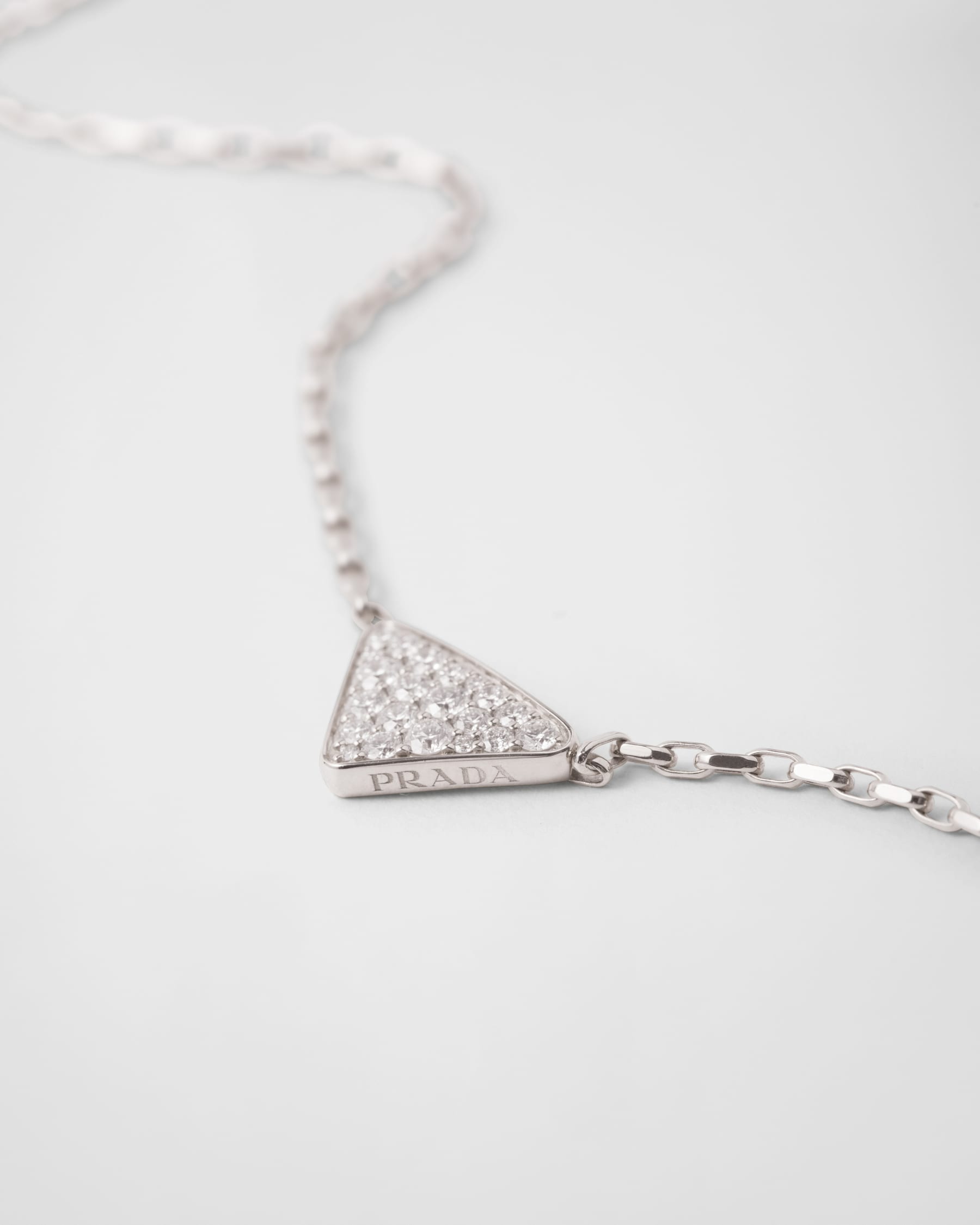 Prada Eternal Gold mini triangle pendant necklace in white gold and diamonds