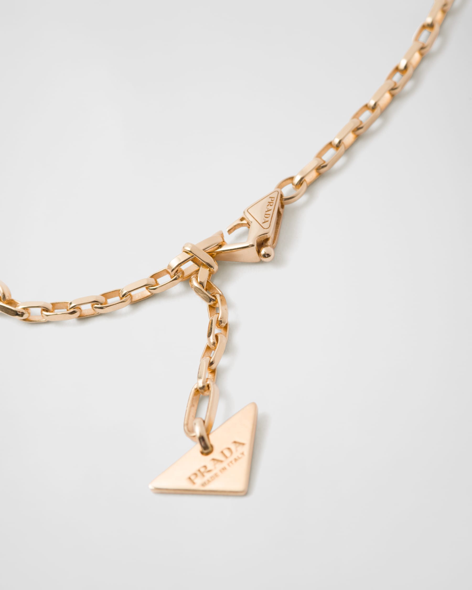 Prada Eternal Gold Eternal mini triangle pendant necklace in yellow gold and diamonds