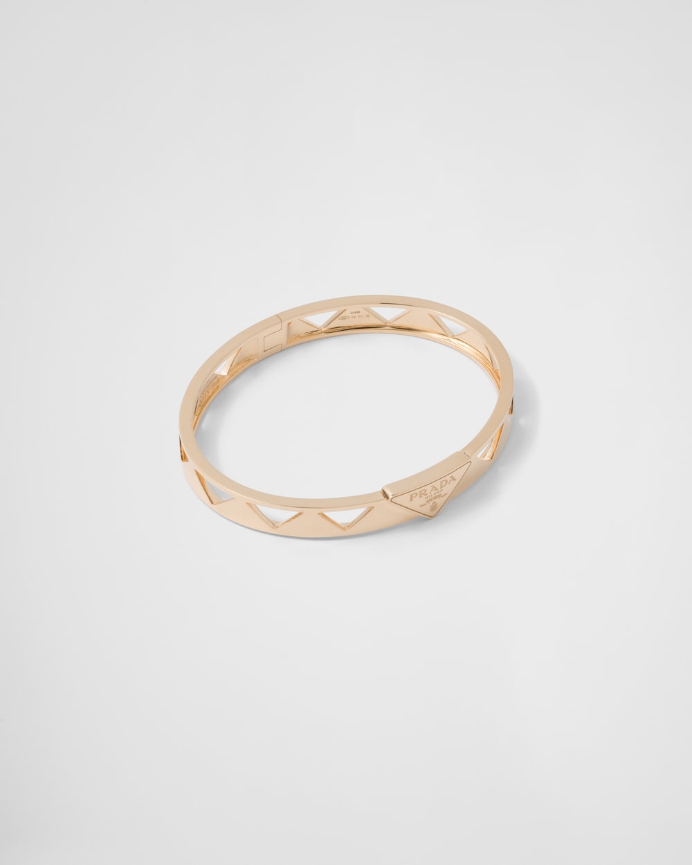 Prada Eternal Gold cut-out bangle bracelet in yellow gold