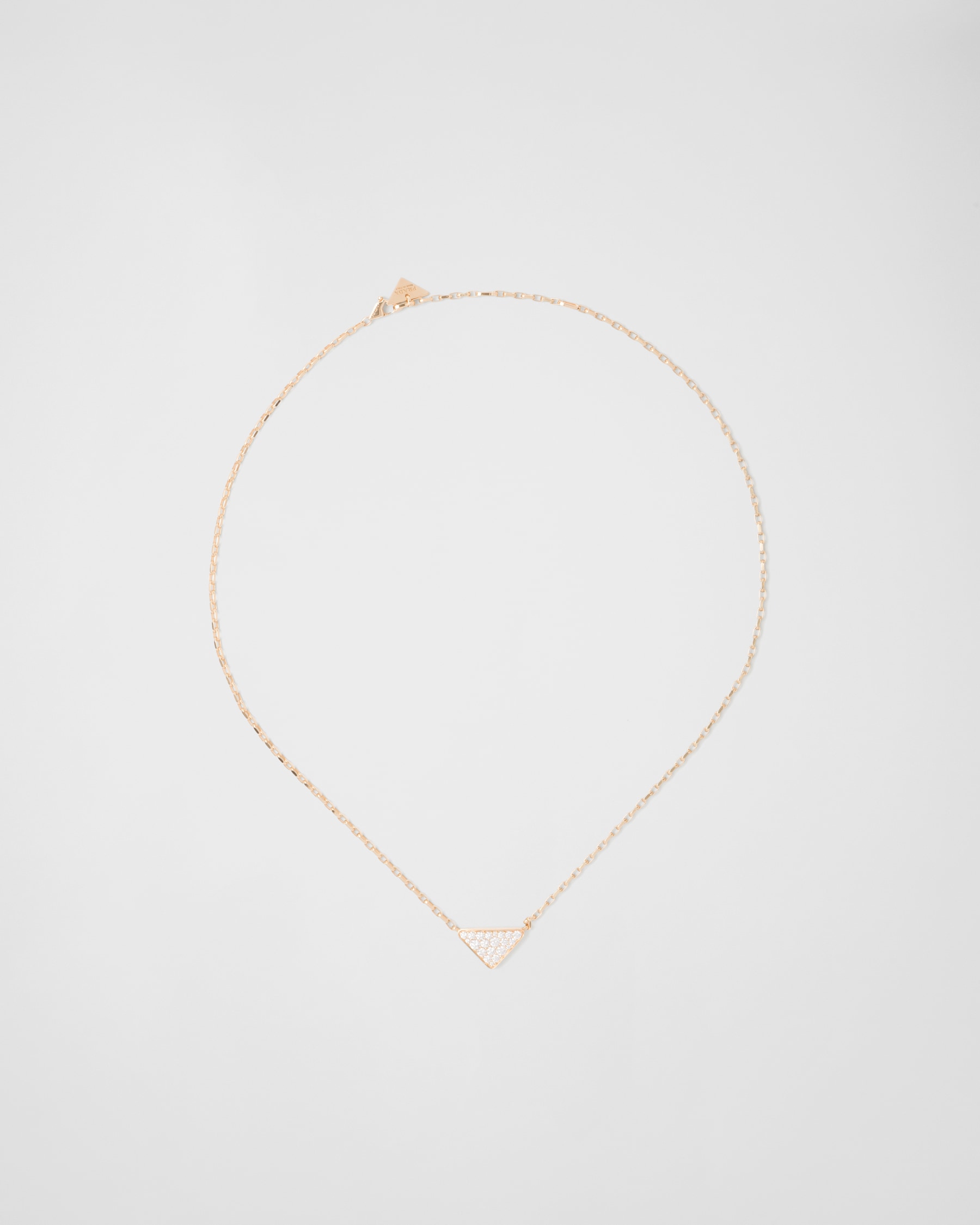 Prada Eternal Gold Eternal mini triangle pendant necklace in yellow gold and diamonds