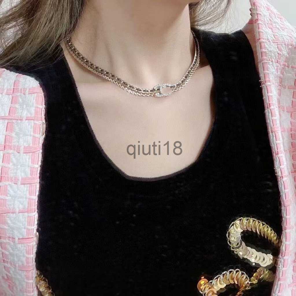 Black leather chain double C stirrup bracelet