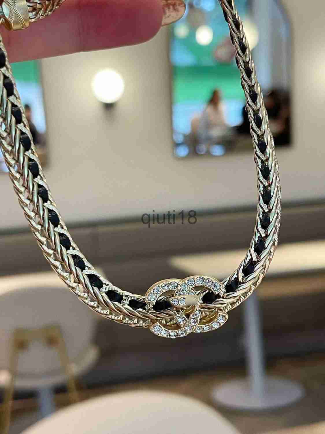 Black leather chain double C stirrup bracelet