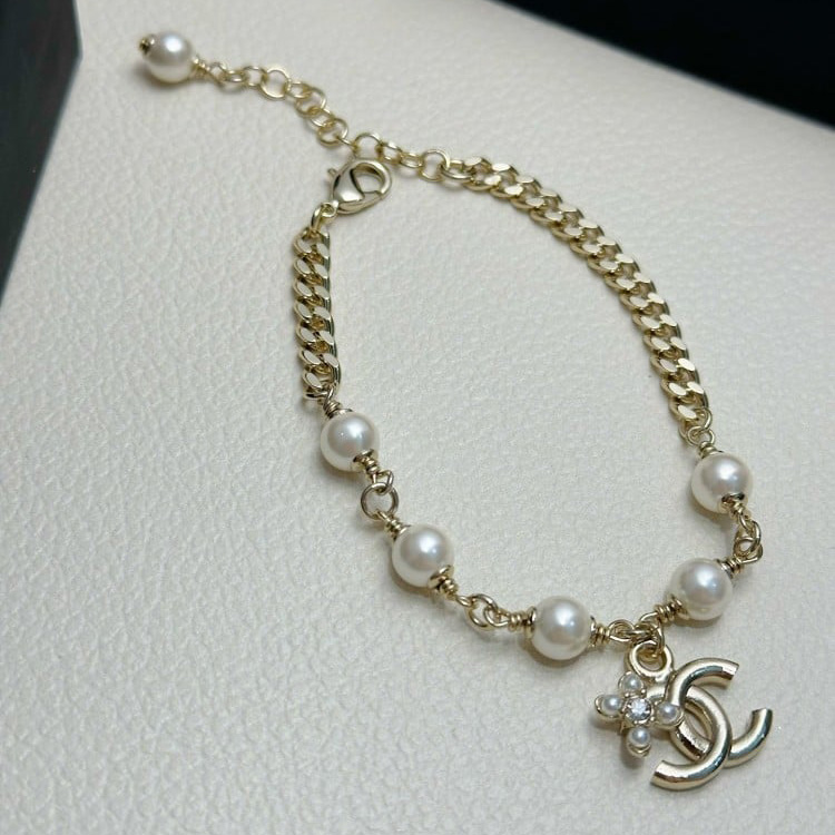 Double row pearls and diamonds double C bracelet