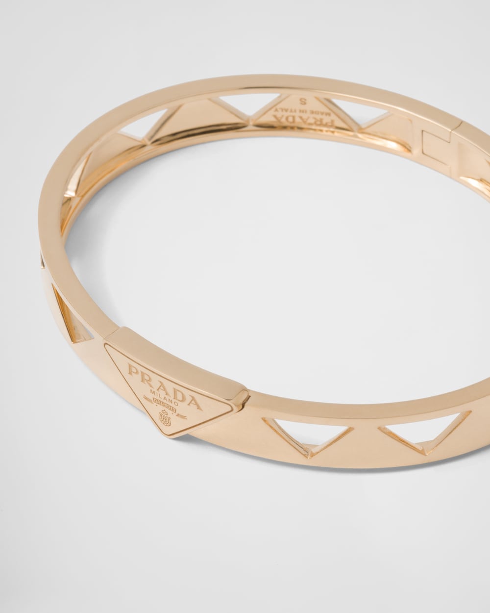 Prada Eternal Gold cut-out bangle bracelet in yellow gold