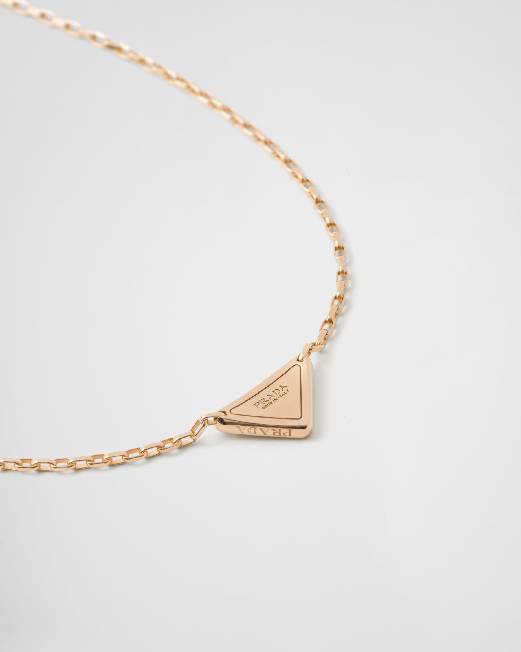 Prada Eternal Gold Eternal mini triangle pendant necklace in yellow gold and diamonds