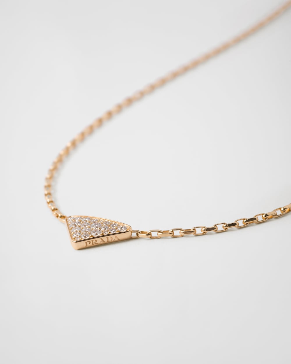 Prada Eternal Gold Eternal mini triangle pendant necklace in yellow gold and diamonds